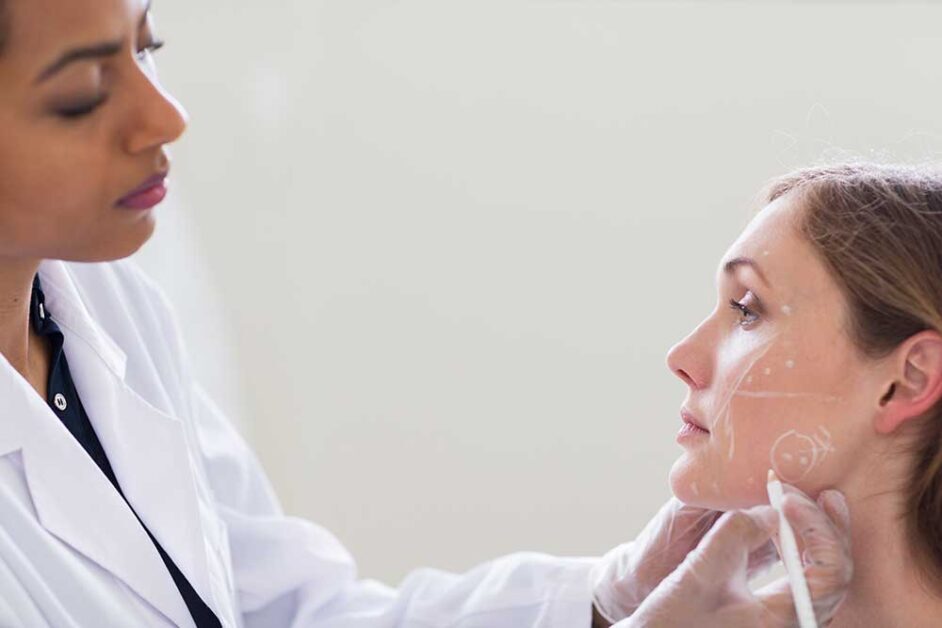 Dermatologist assessing patient’s skin representing science-backed niacinamide skincare formulations by Beaucience India.